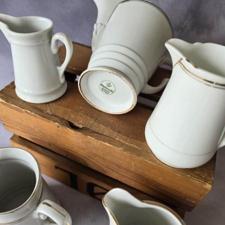 Set aus 5 antiken Milchkännchen