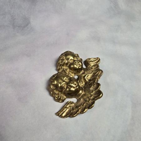 Putti - Engelsköpfe aus Messing